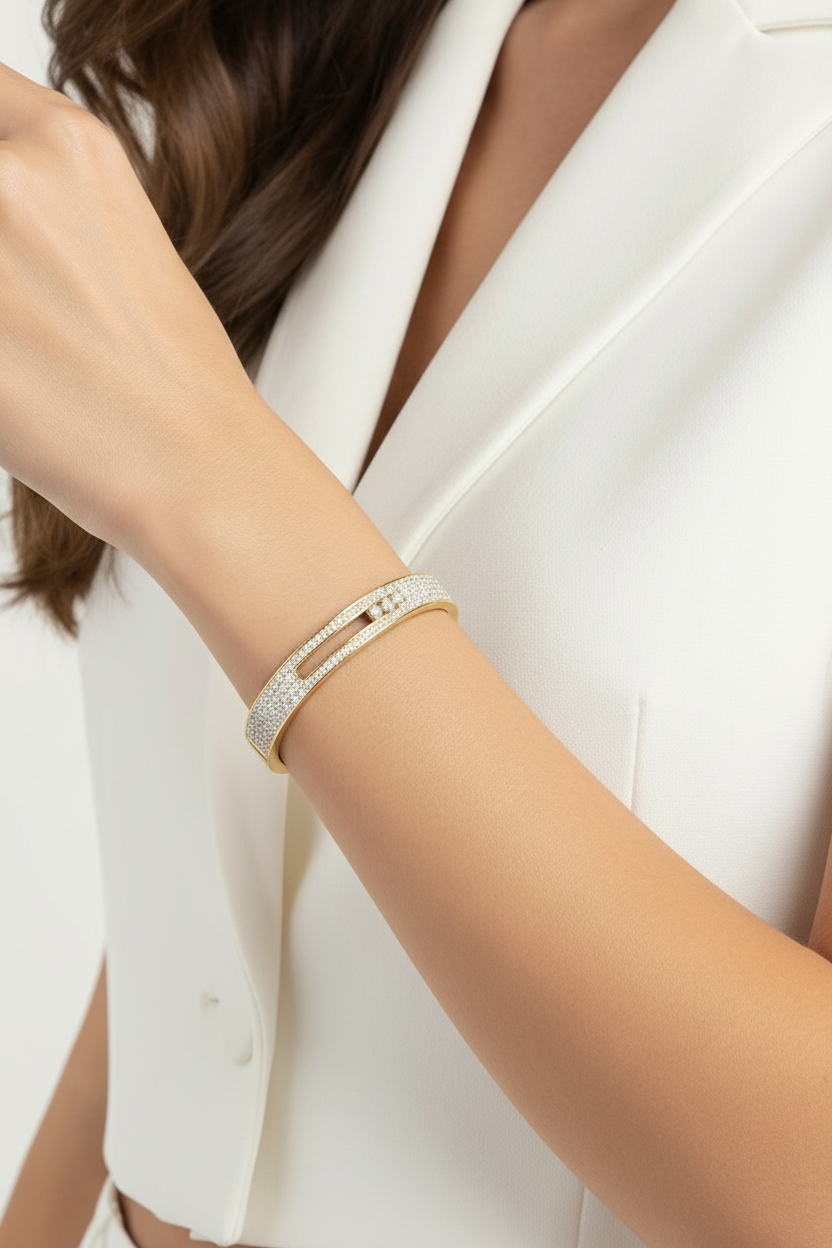 Close-up of a person wearing a bracelet on a plain background