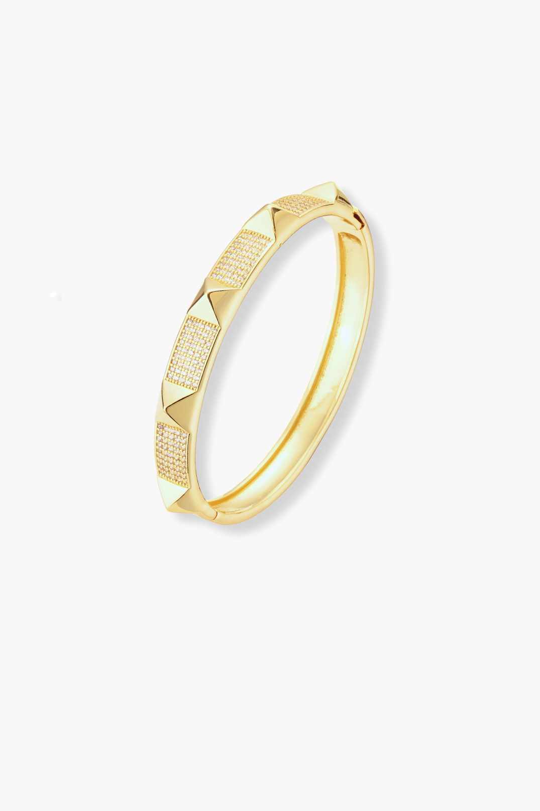 Gold bracelet with a textured design on a white background