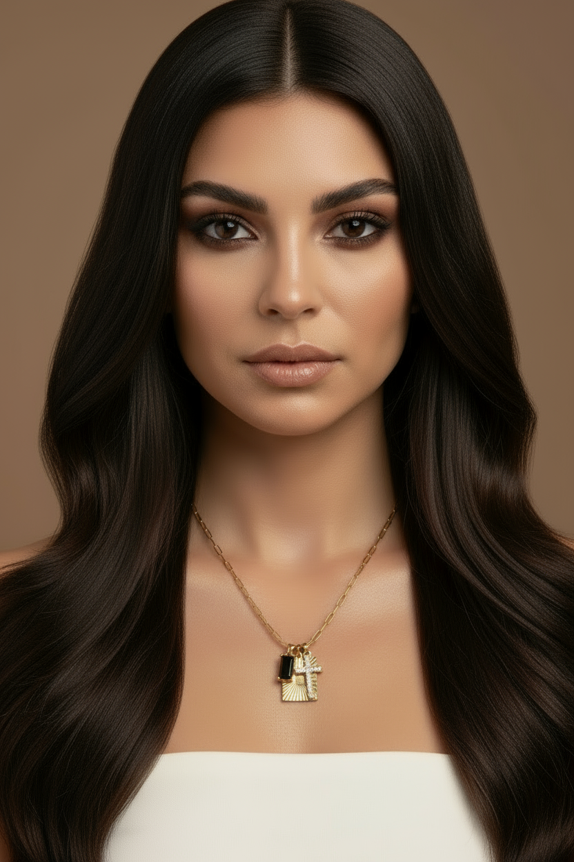 Gold necklace with a pendant on a white background